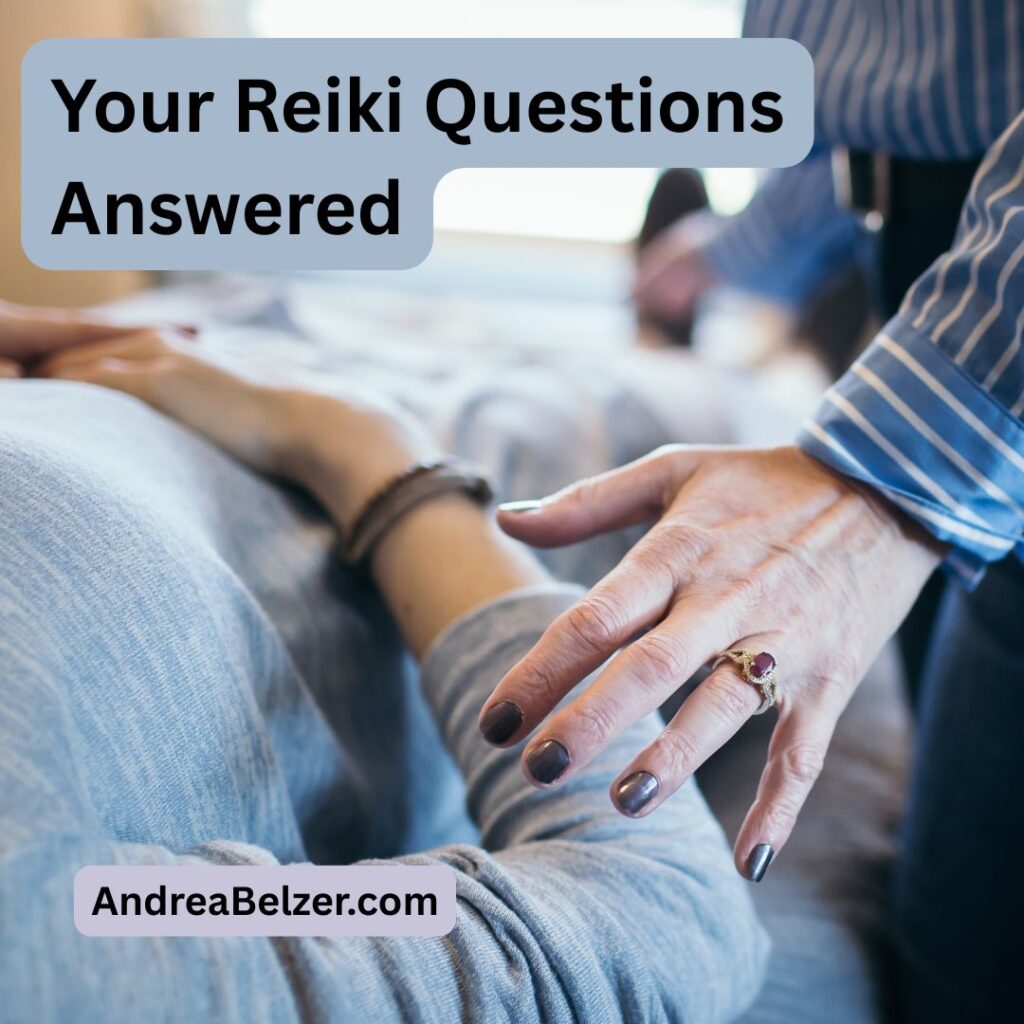 Close up image of a Reiki session, with the practitioners hands lightly over the client. Text overlay saying - "Your Reiki Questions Answered" and "andreabelzer.com"