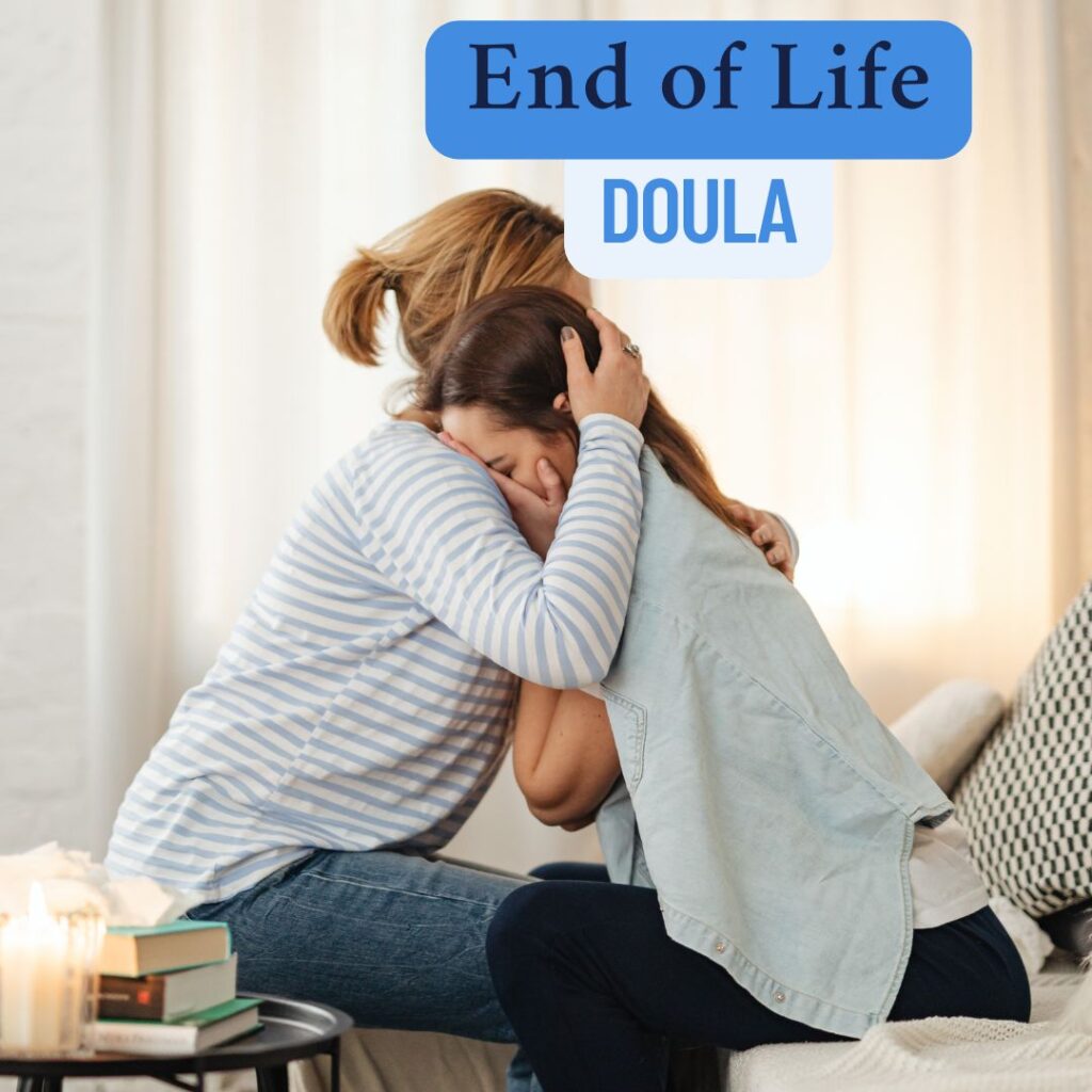 Image of a woman giving a hug as support to another woman who is crying. They are sitting in a room with a couch and table. The text is "end-of-life doula."